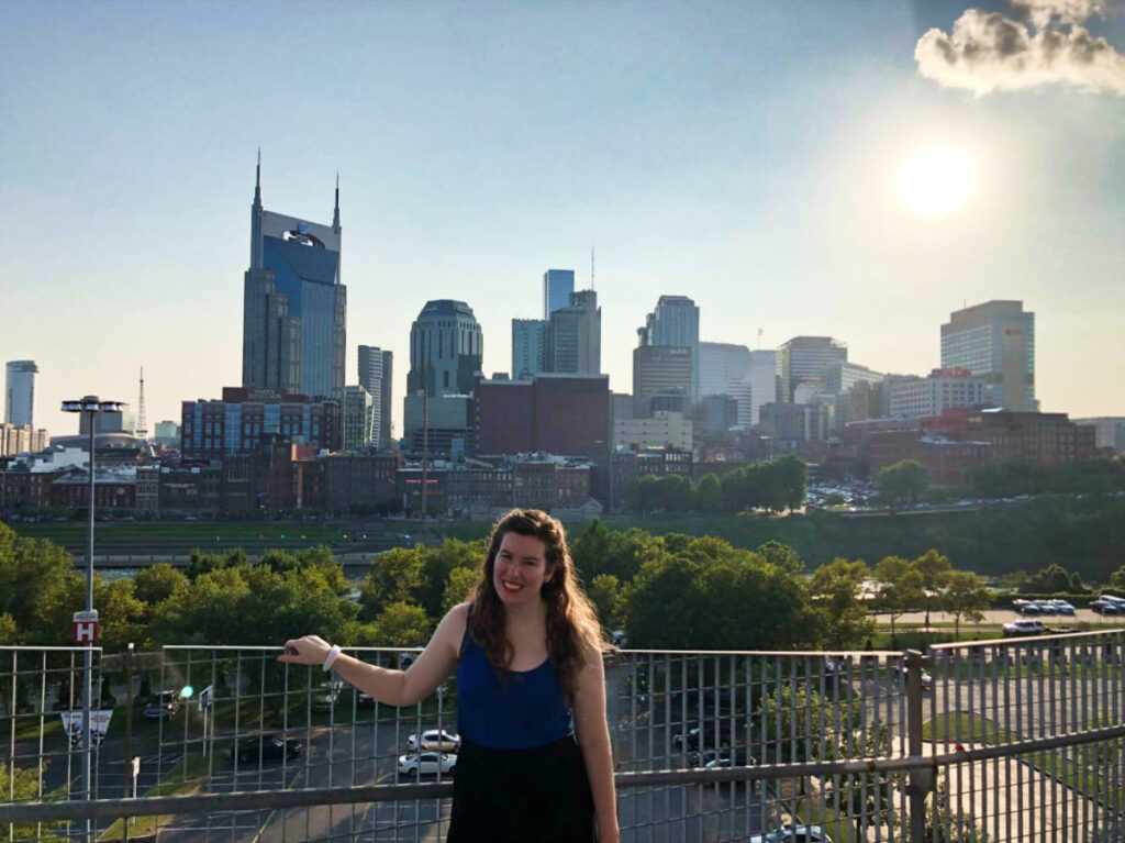 The author Elizabeth Demolat, wearing a tank top in summer at Nissan Stadium