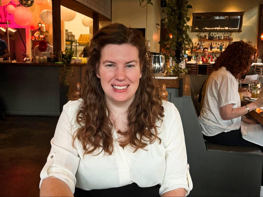 The author Elizabeth Demolat, sitting inside the Peninsula
