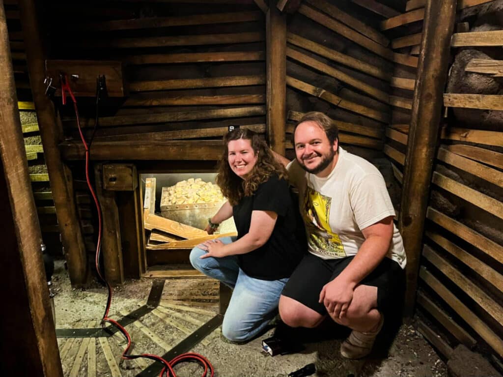 Thea author Elizabeth Demolat and her husband posing for a photo at The Escape Game