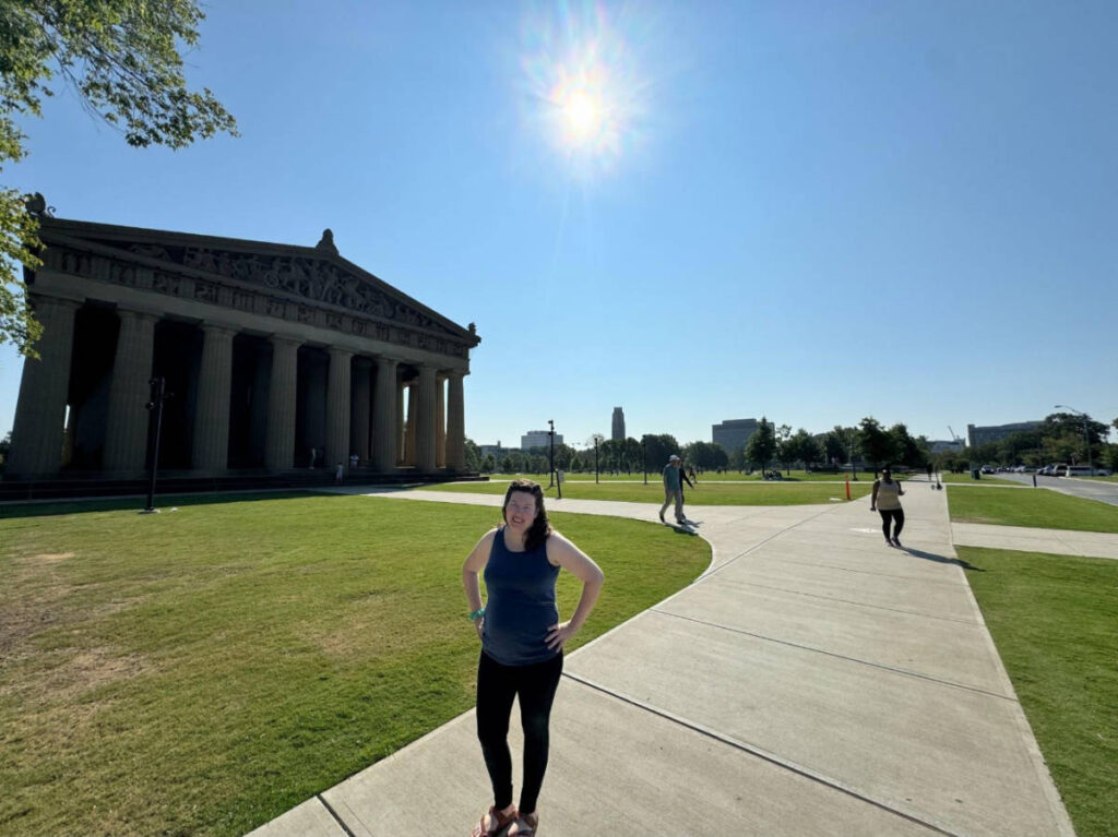 The author Elizabeth Demolat posing for a photo at the Nashville Parthenon