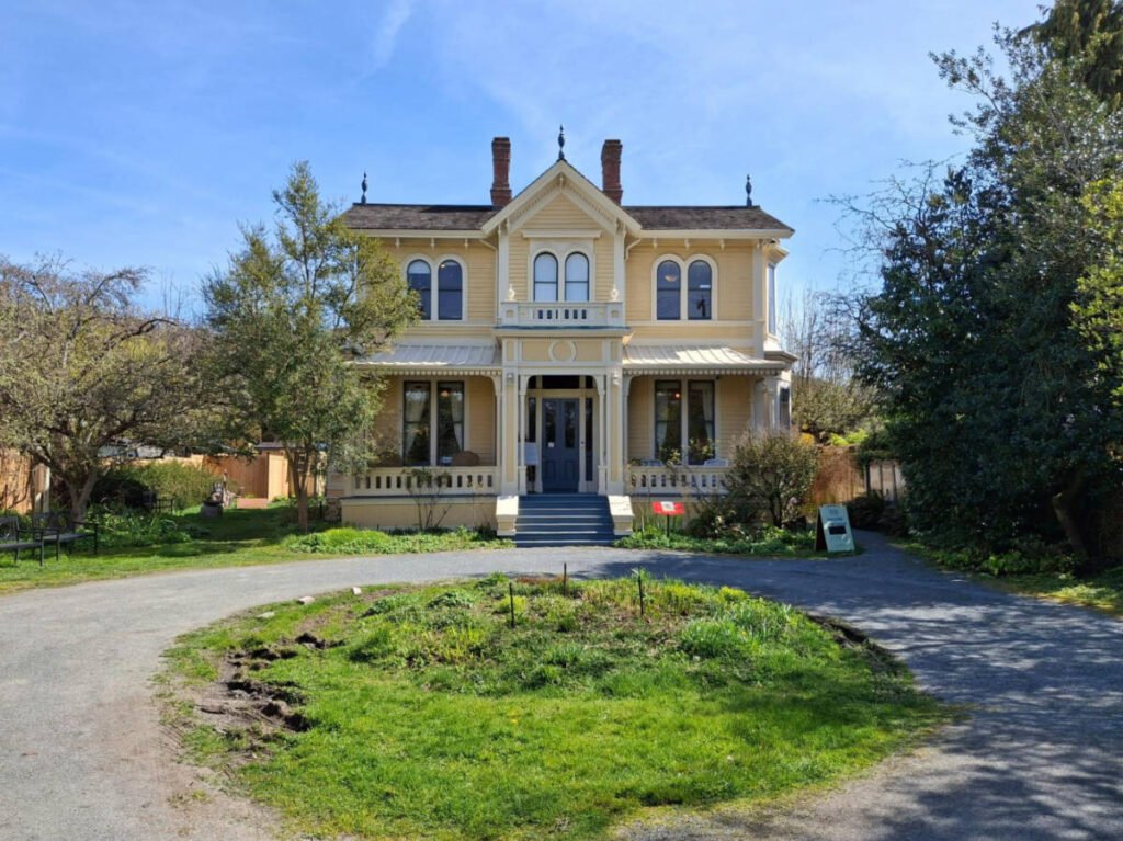 View of the yellow exterior of the house of the artist Emily Carr
