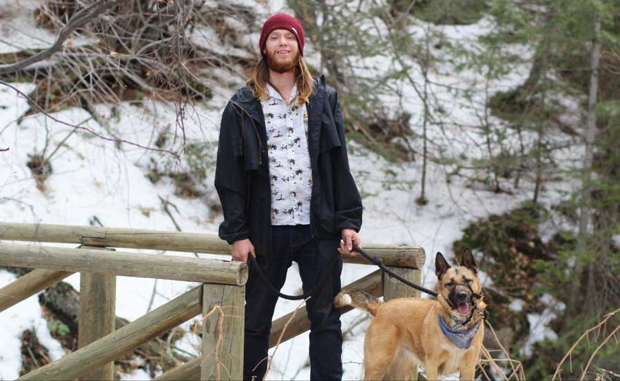 The author's husband with their dog at the Apex Park