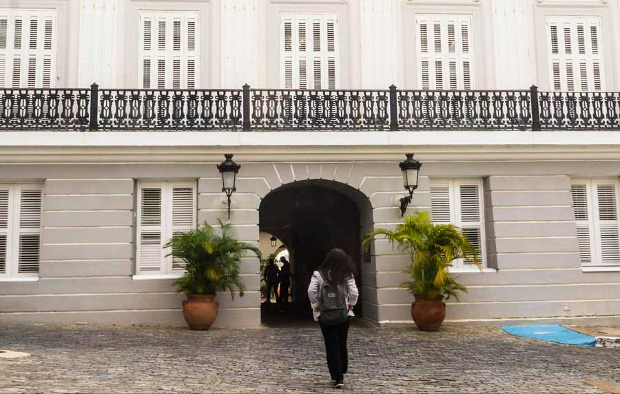 The author going inside La Fortaleza