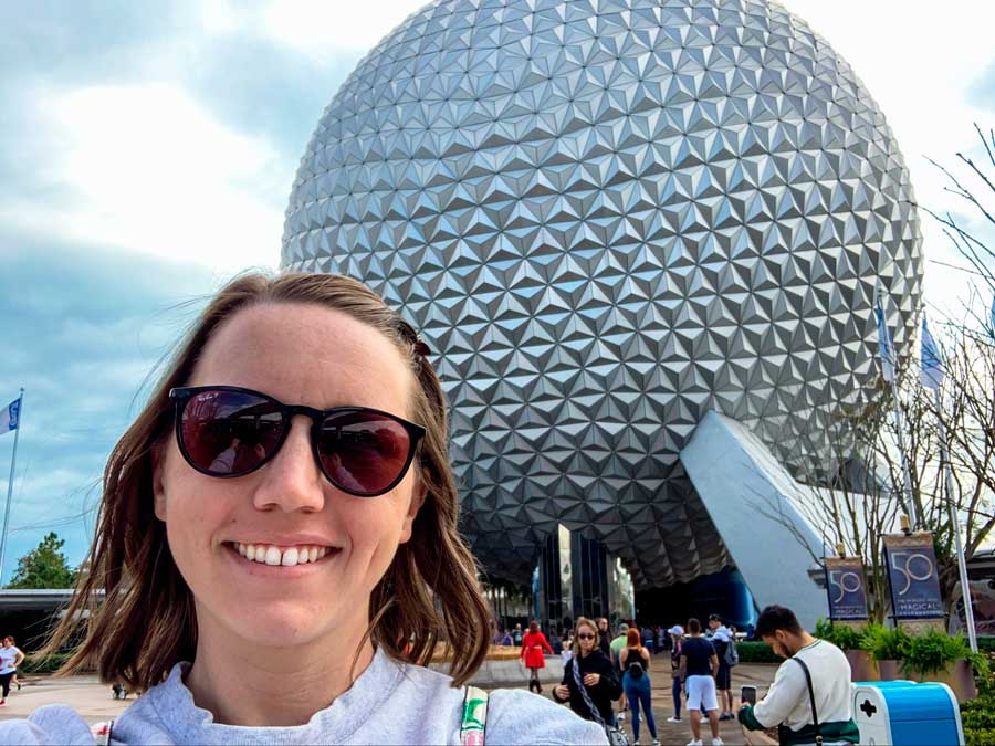 The author and the Epcot Ball on her background