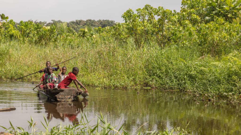 View of kids on a boat at the Epe Mangroves