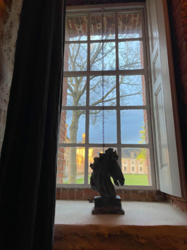 Horse head sculpture on window sill at Château de Fleury
