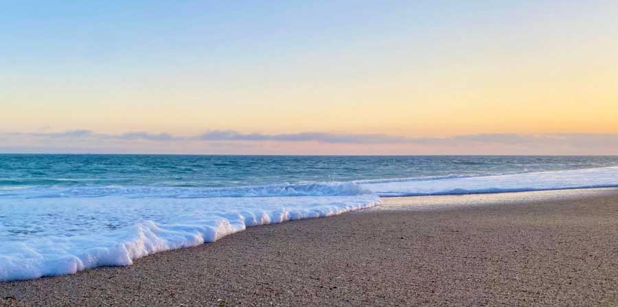 View of the waves coming to the sand in Escondido Beach