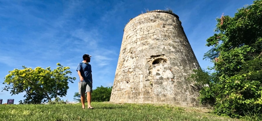 A man wandering around the ruins of the estate of Little Princess Plantation