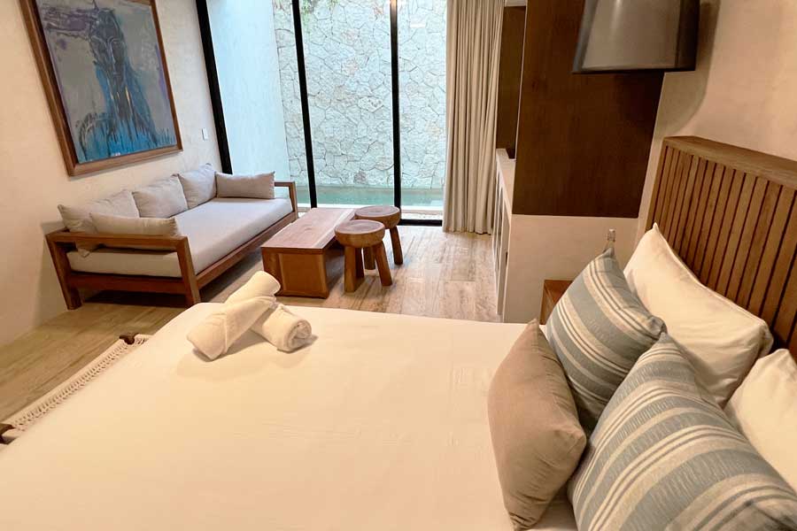 View inside a bedroom in Eterna Tulum Bed