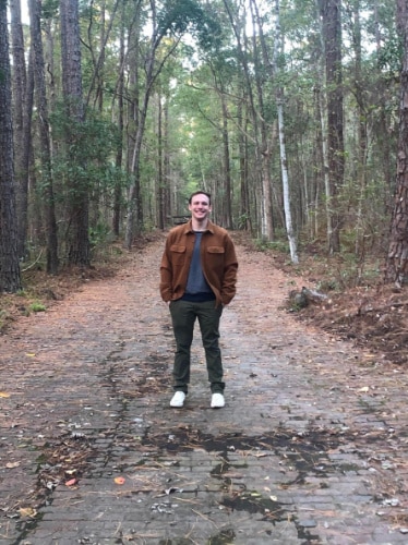 Ethan Thoren smiling for a photo in Tillie Park in Jacksonville, Florida