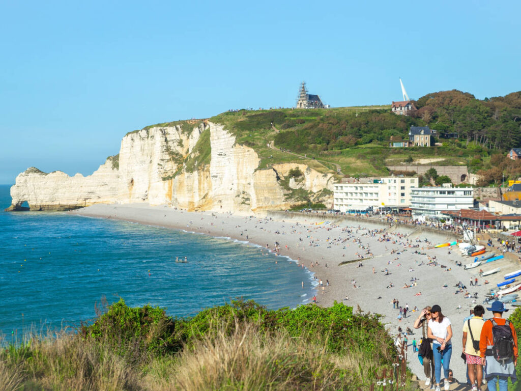 View of the La Falaise d'Amont and the crowd on the beach