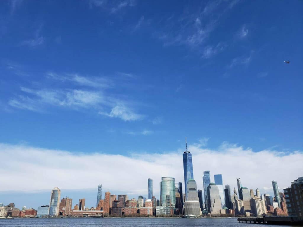 Clear blue sky over the buildings in New Jersey, a view from the Exchange Place Waterfront