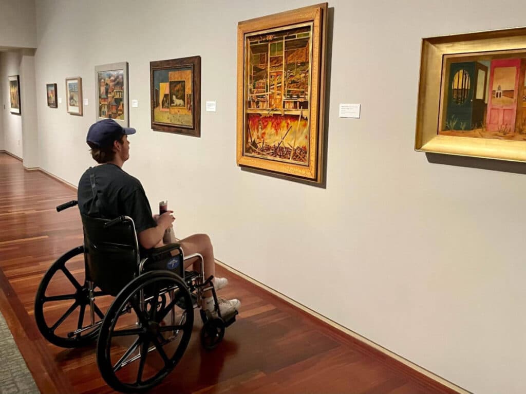 The author's friend admiring an exhibit in Phoenix Art Museum