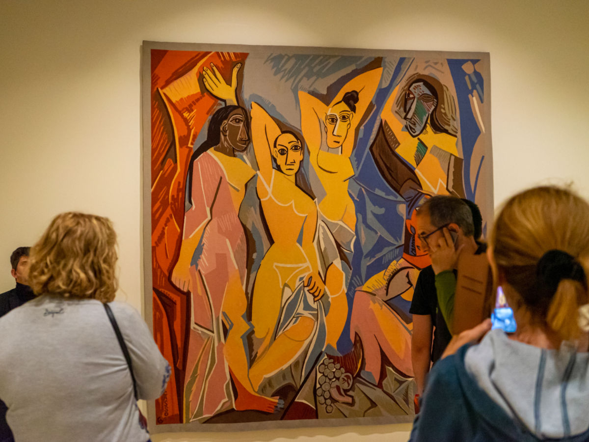 People looking at a painting in Picasso Museum
