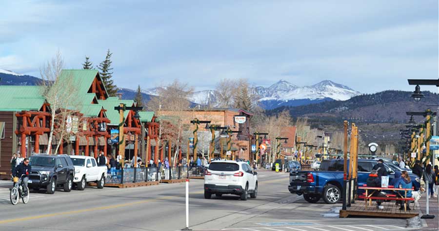 View of people and vehicles in Downtown Frisco