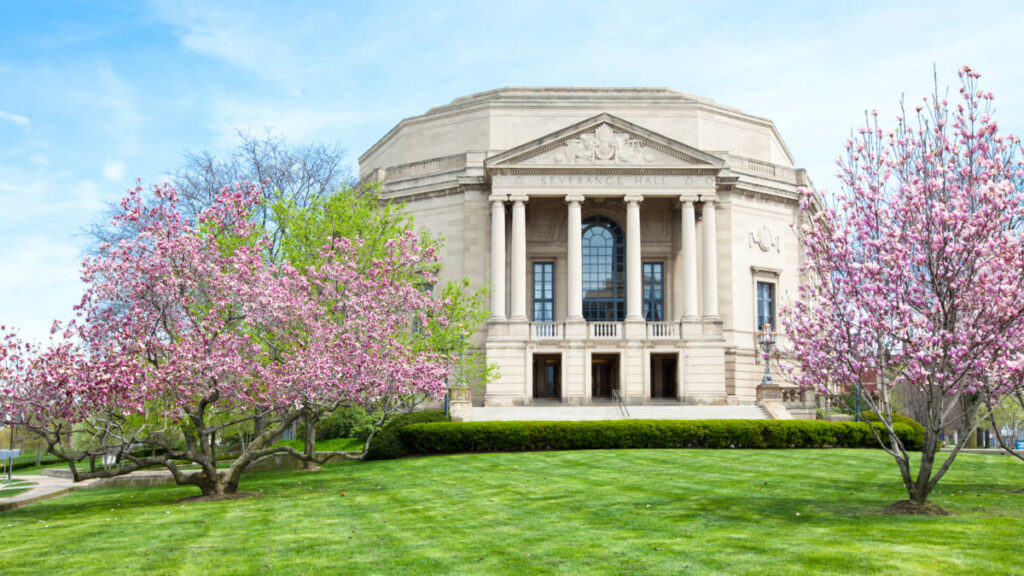 Exterior view of the Severance Hall with cherry blossoms trees around
