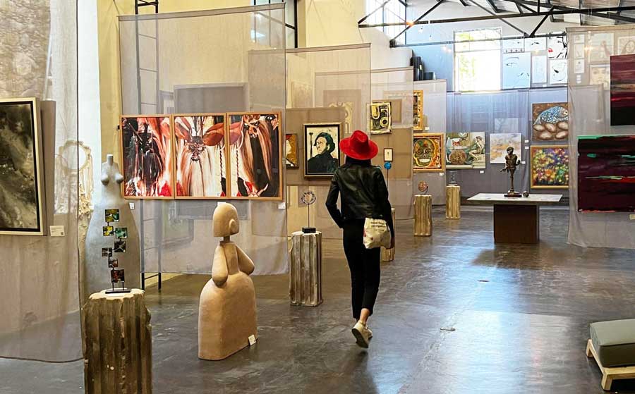 Clara admiring the paintings in Fabrica la Aurora