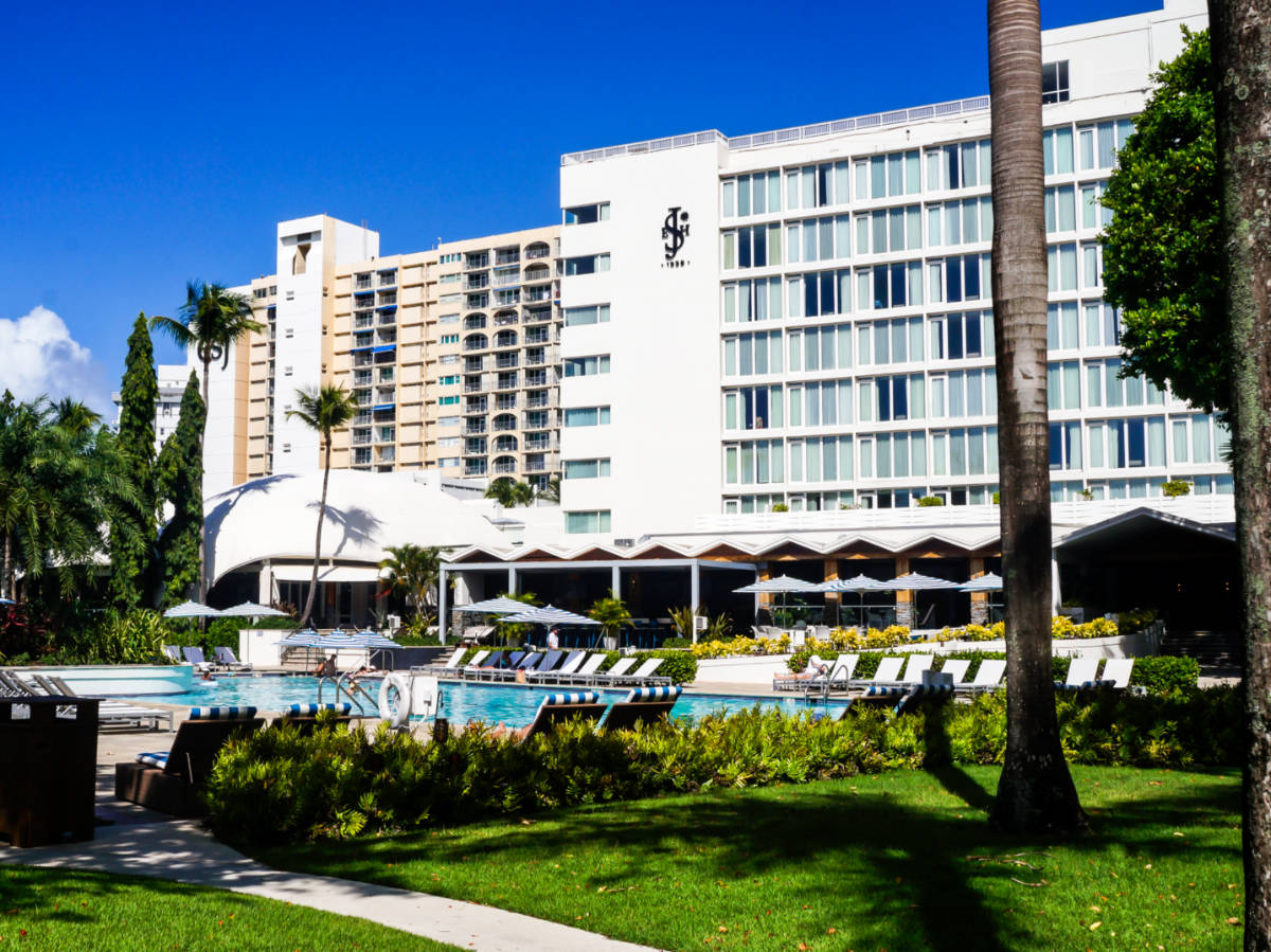 Exterior and pool area view of Fairmont El San Juan Hotel