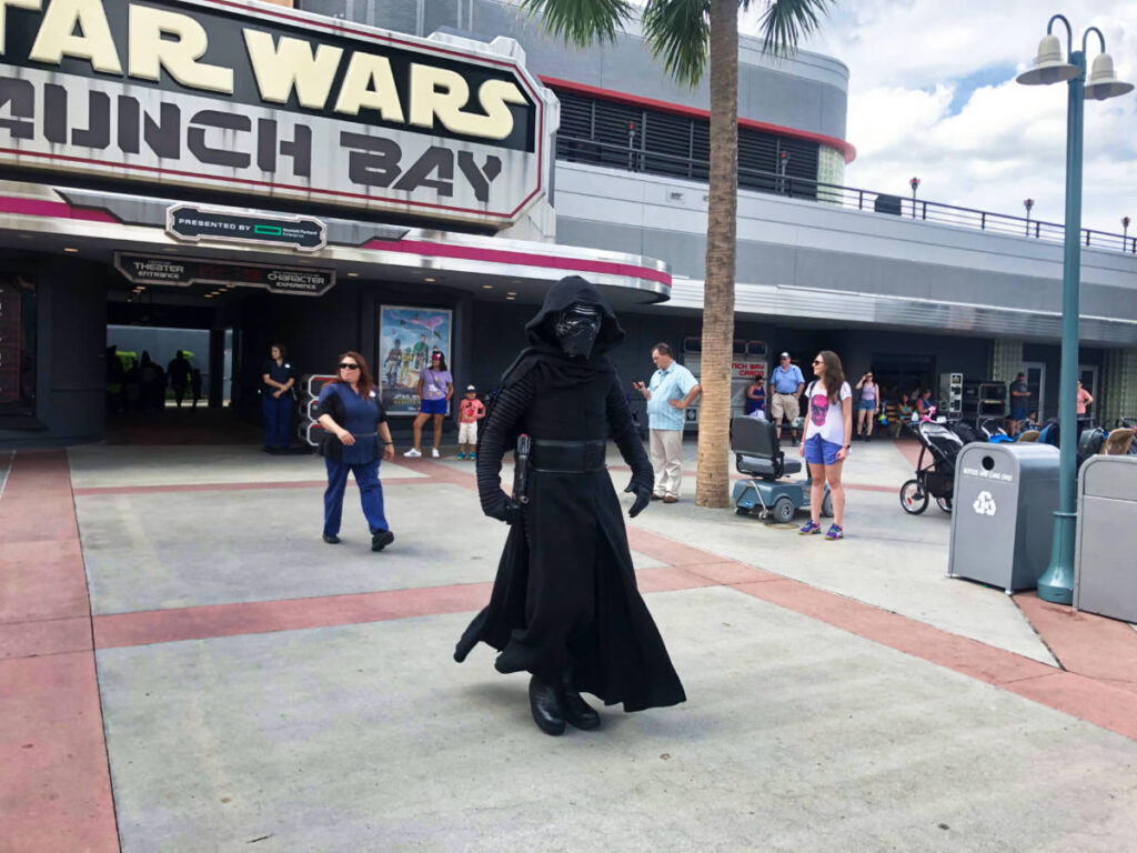 A man in costume in front of the Star Wars Launch Bay