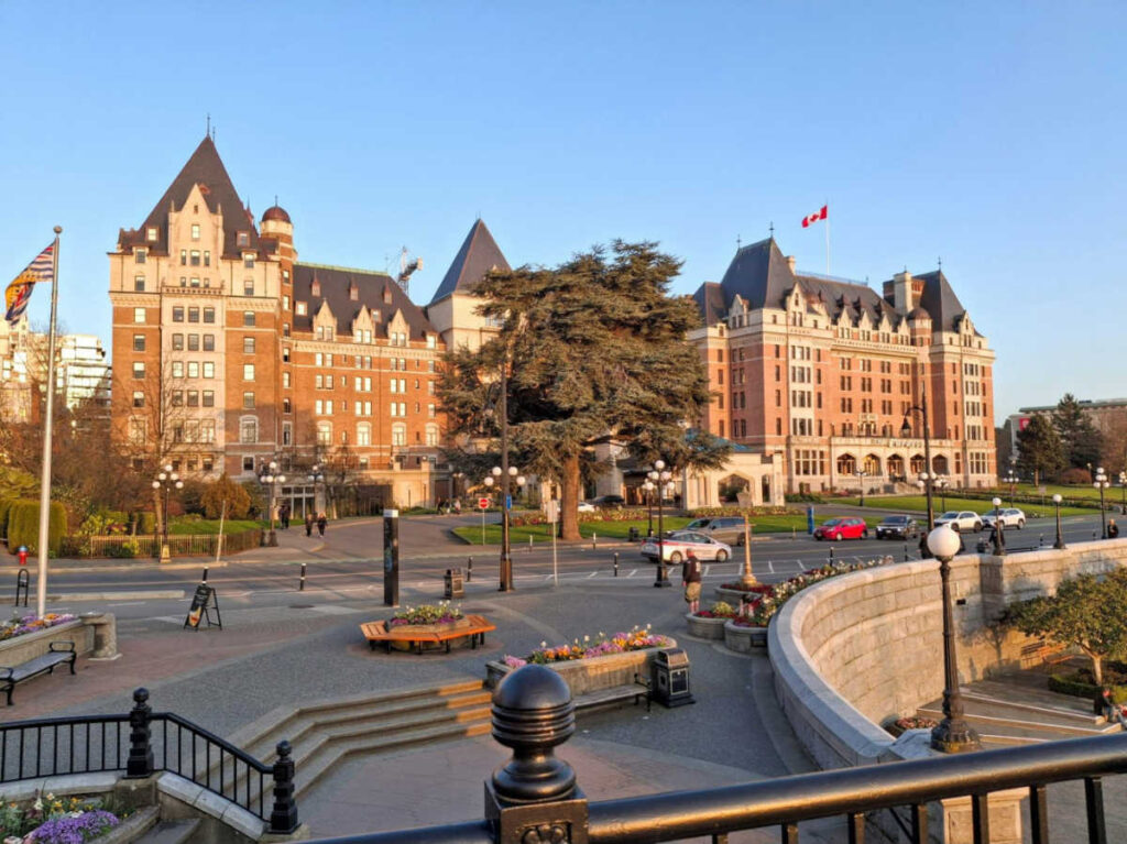 The sunset reflecting on the exterior of Fairmont Empress Hotel