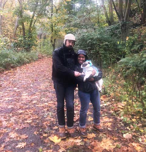 The author with her husband and dogs posing for a picture in Seattle during fall season