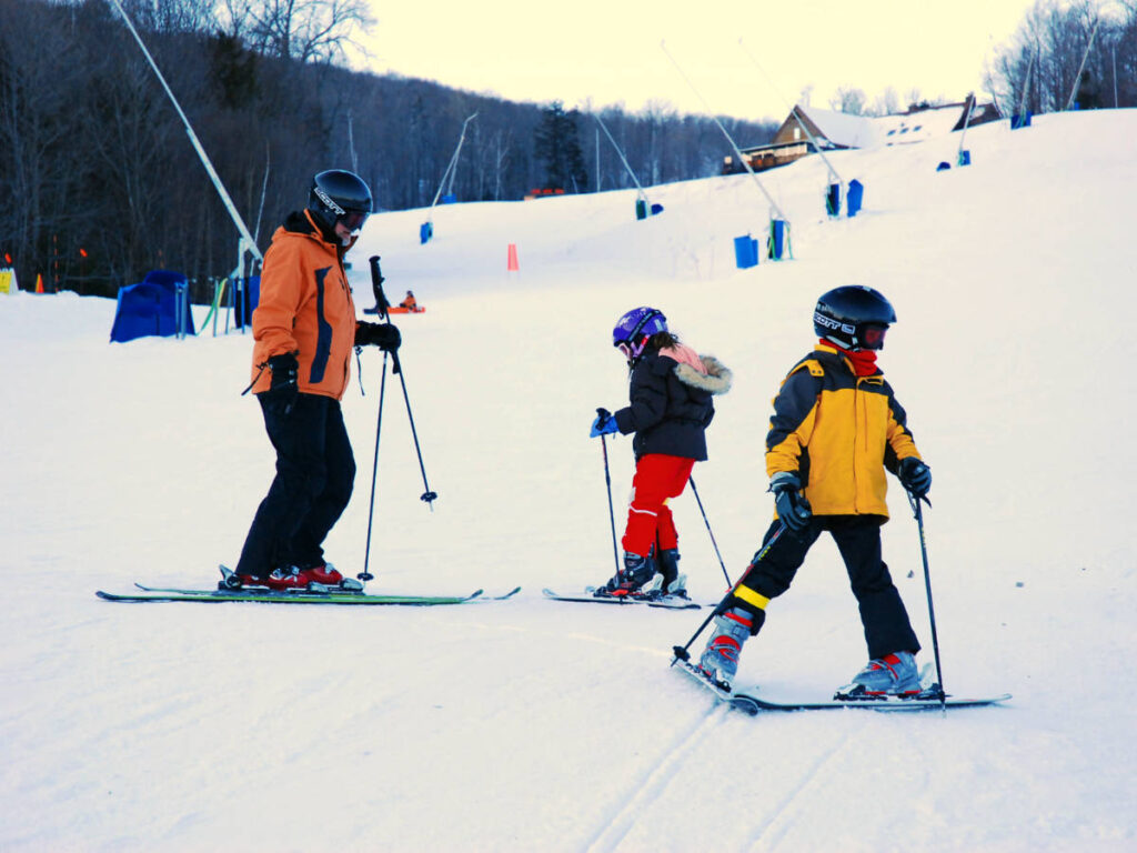 A family skiing at the ski resort