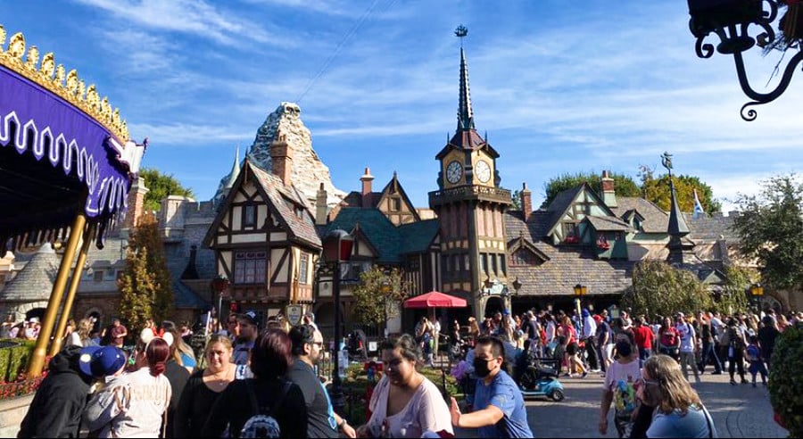 A sunny crowded day in the street of Fantasyland in Disneyland