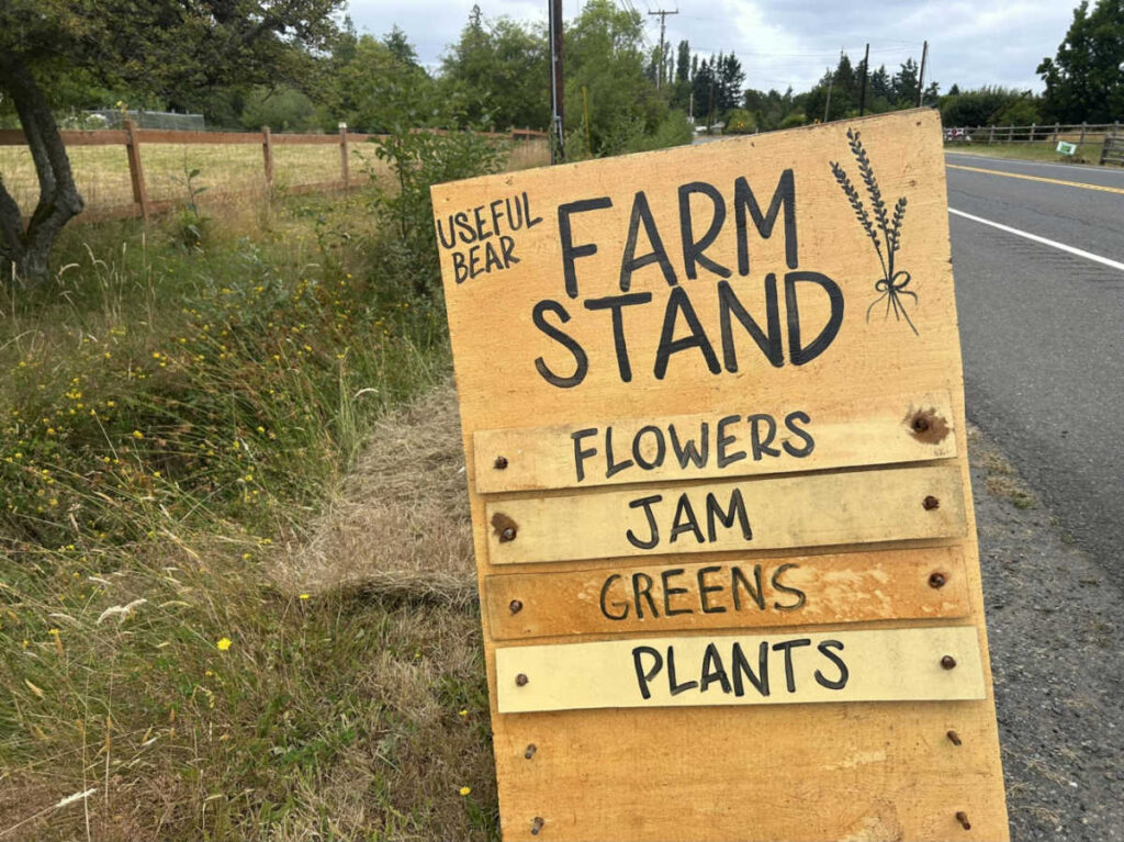 Closeup look of the wooden farm stand sign in Farmers Market & Farm Stands