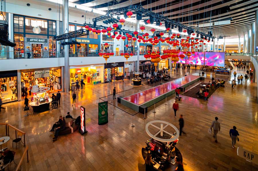 People wandering inside the Fashion Show Mall