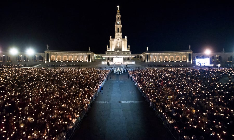 A candlelight procession outside a cathedral in Fatima