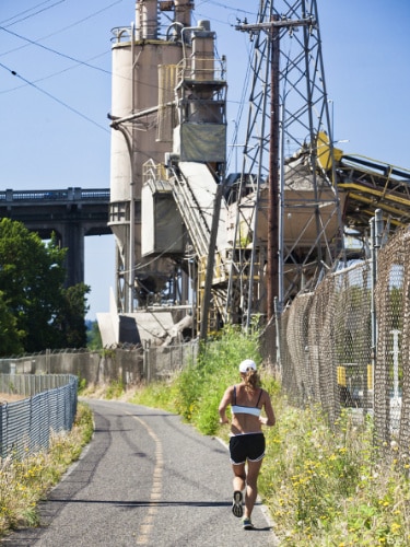 A female runner along the Springwater Corridor Trail