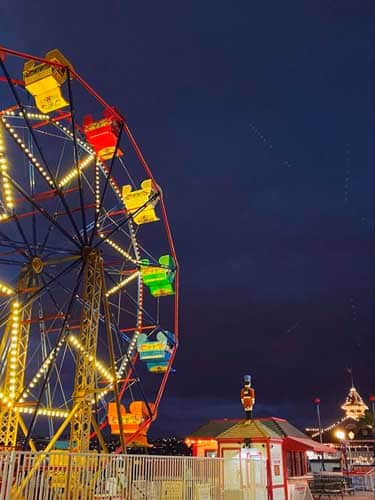 Ferris wheel with lights at night in Balboa Fun Zone