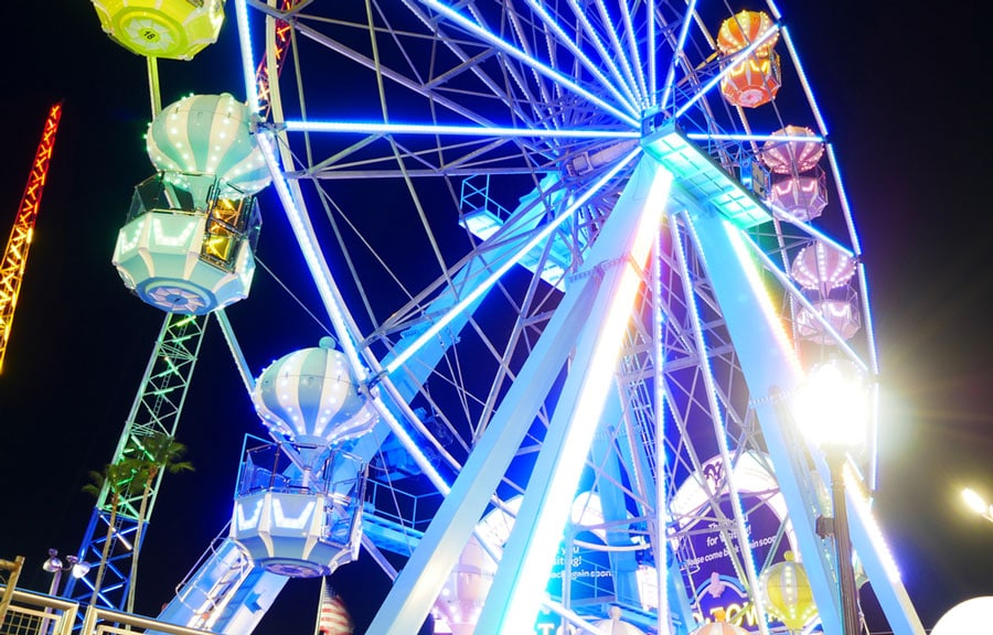 View of a colorful ferris wheel at night