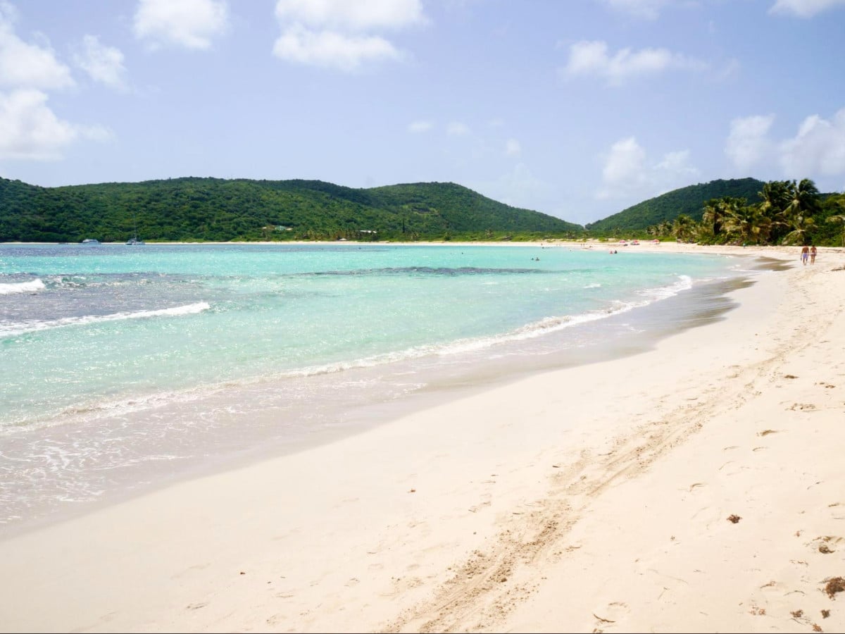Scenic view of the clear water and white sand in Flamenco Beach