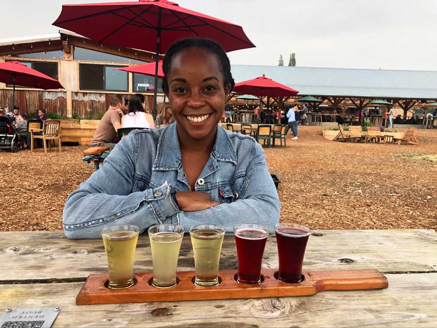 The author with a cider flight on the table in Finnriver Cidery
