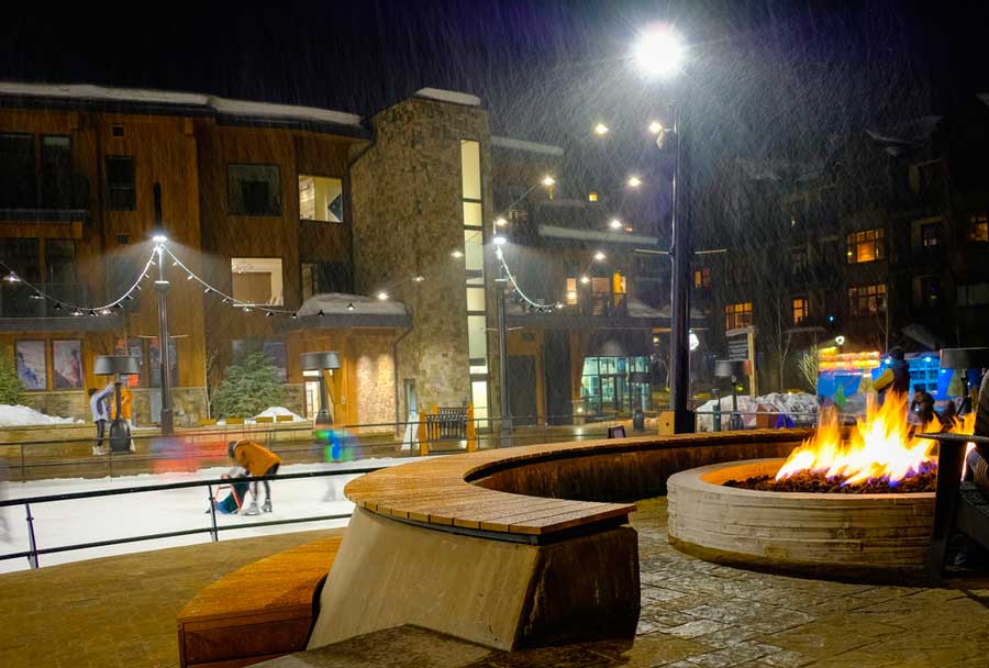 A fire pit and a skating rink in Aspen during winter