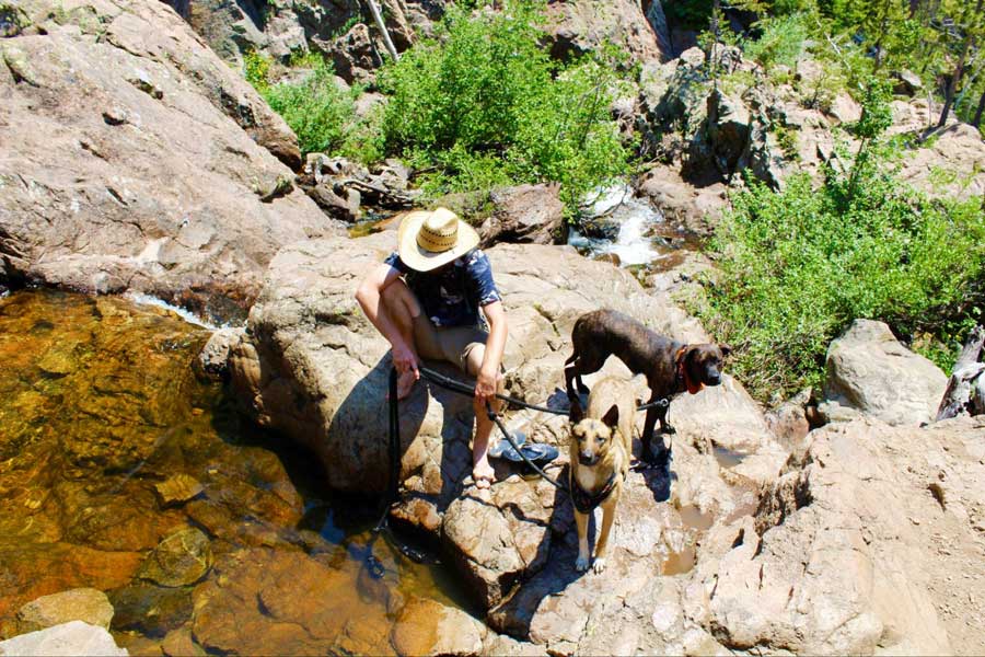 The author's husband with their dog in Fish Creek Falls