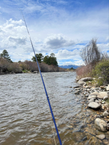A fishing rod and line with mountain views