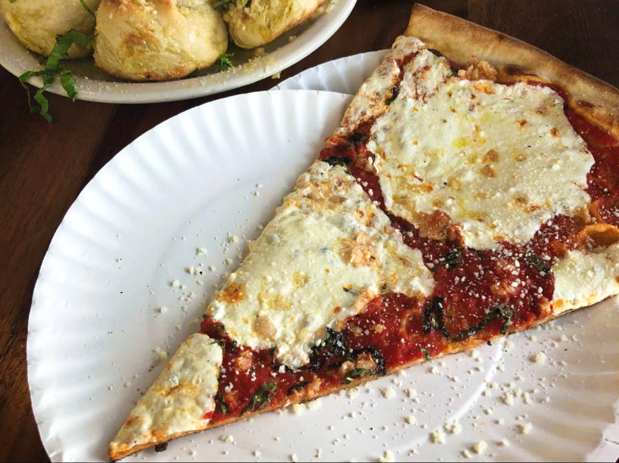 A slice of Italian-inspired pizza from Five Points Pizza