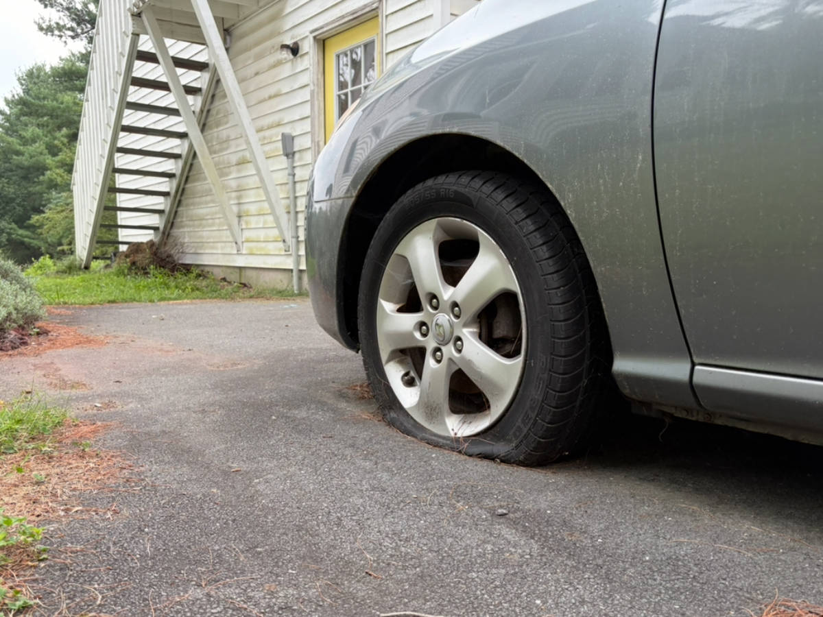 Closeup look of a flat car tire