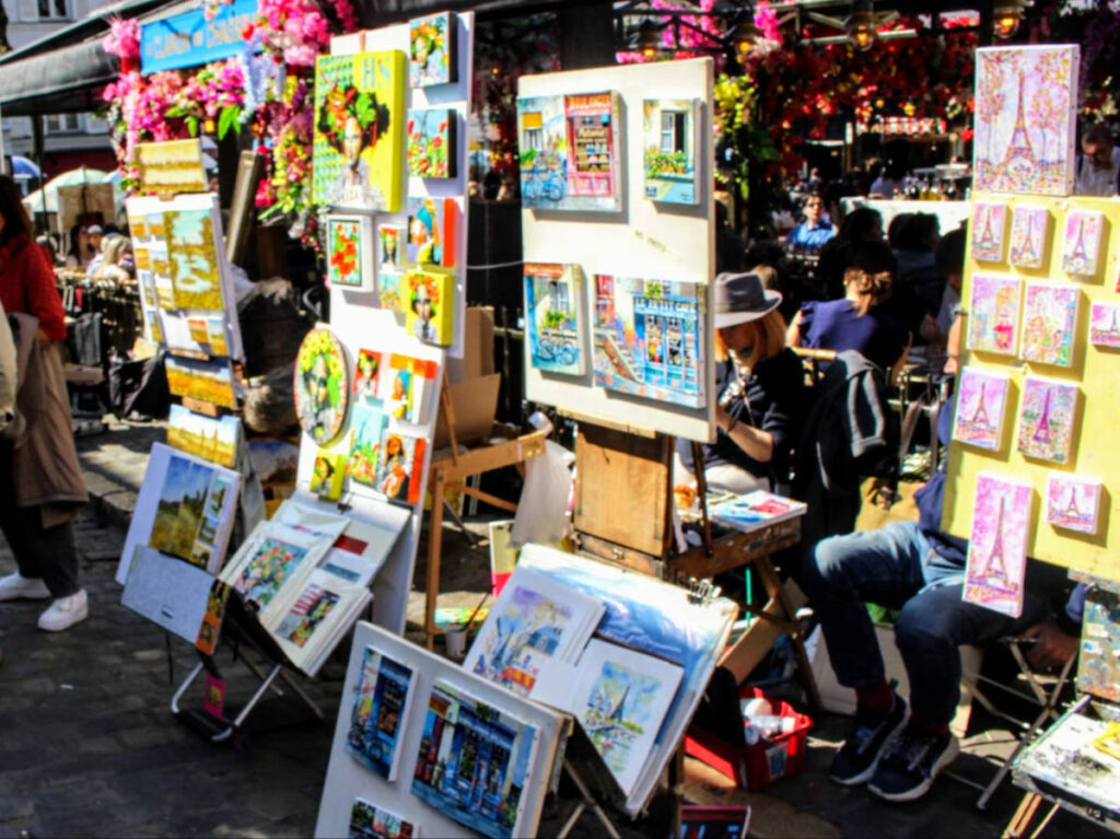 Vendors selling souvenirs at the Flea market stand in Paris