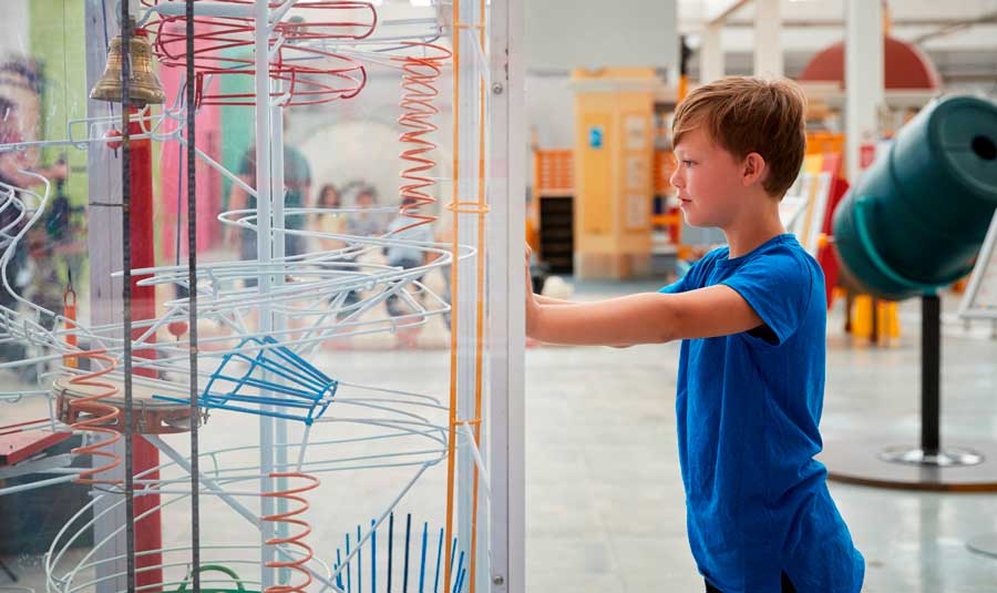 View of a boy looking at a science exhibit in Fleet Science Center