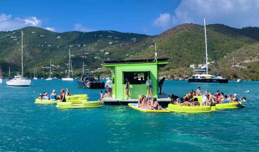 People surrounding the floating taco stand in Coral Bay