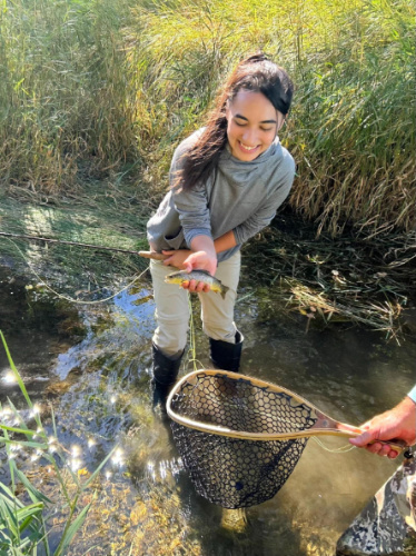 The author, Abigail Bliss fly fishing in Wyoming