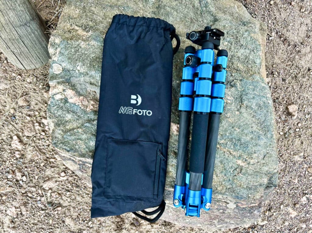 A drawstring bag with the folded length of Benro MeFOTO Roadtrip PRO Carbon Fiber Tripod