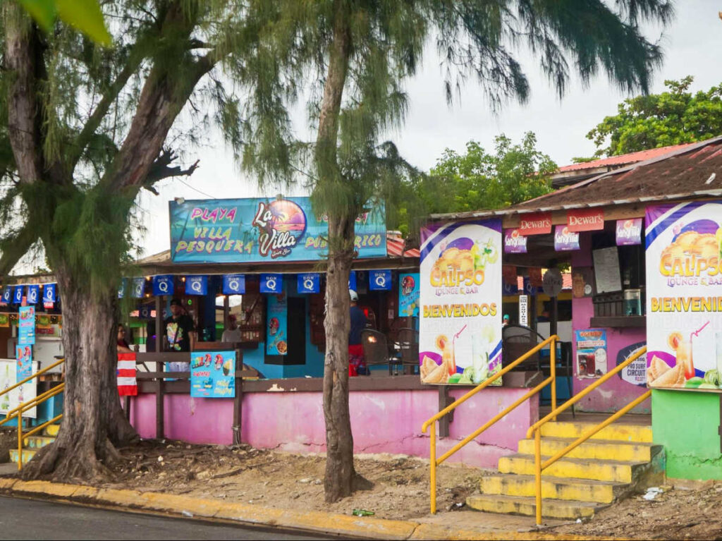 The colorful storefront of the food kiosks at Villa Pesquera