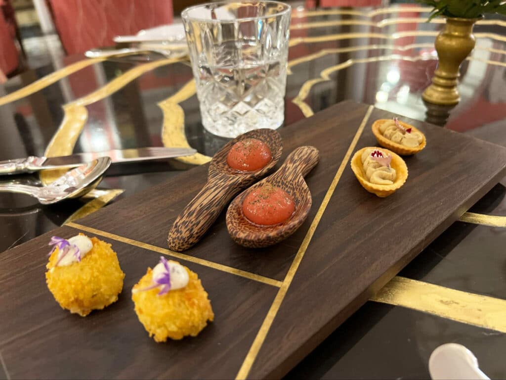 View of food on a wooden board served in Pink Pearl