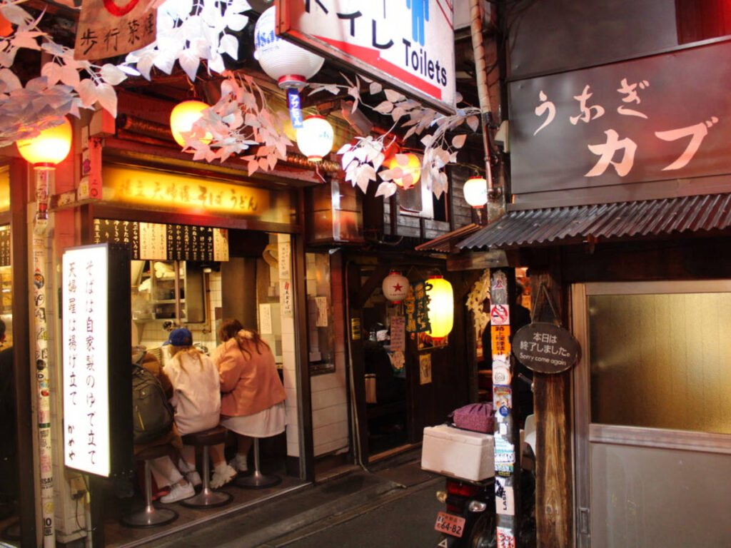 People dining at Food stalls around Golden Gai in Tokyo