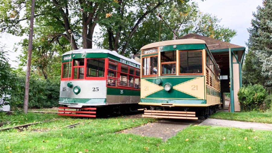 View of two colorful Fort Collins Trolley in Colorado