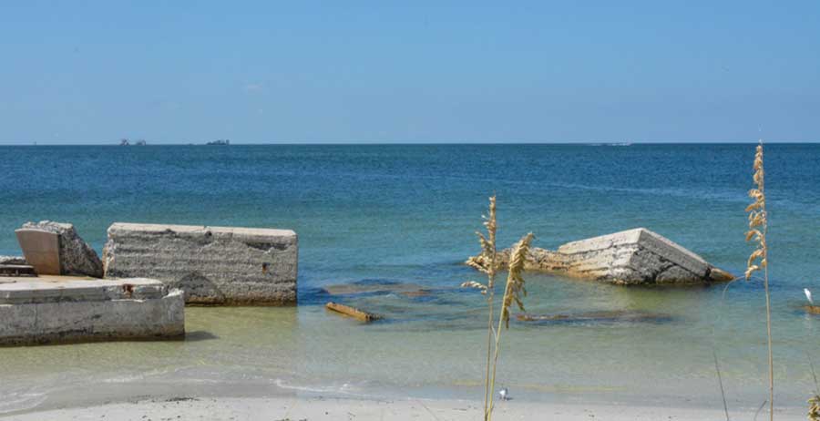 Old concrete of the foundation of Fort De Soto along the beach in St. Petersburg, Florida